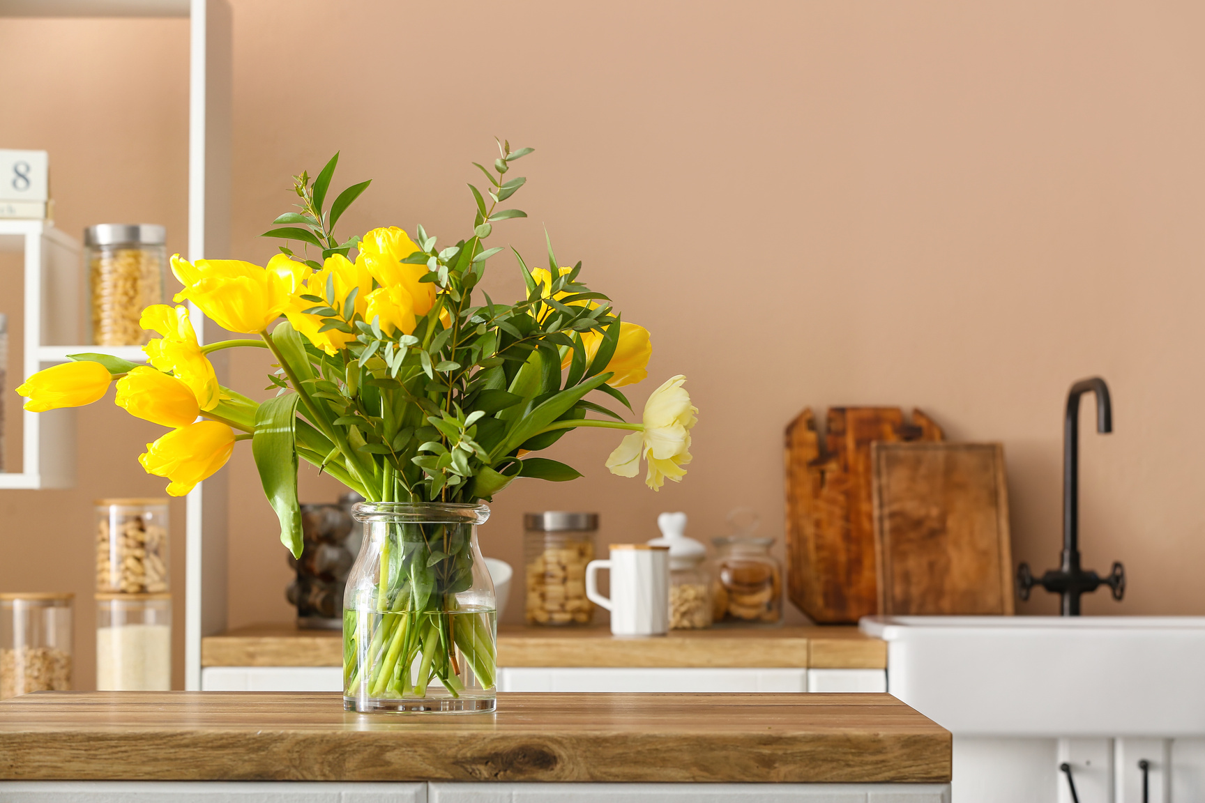 Beautiful Flowers on Wooden Kitchen Counter